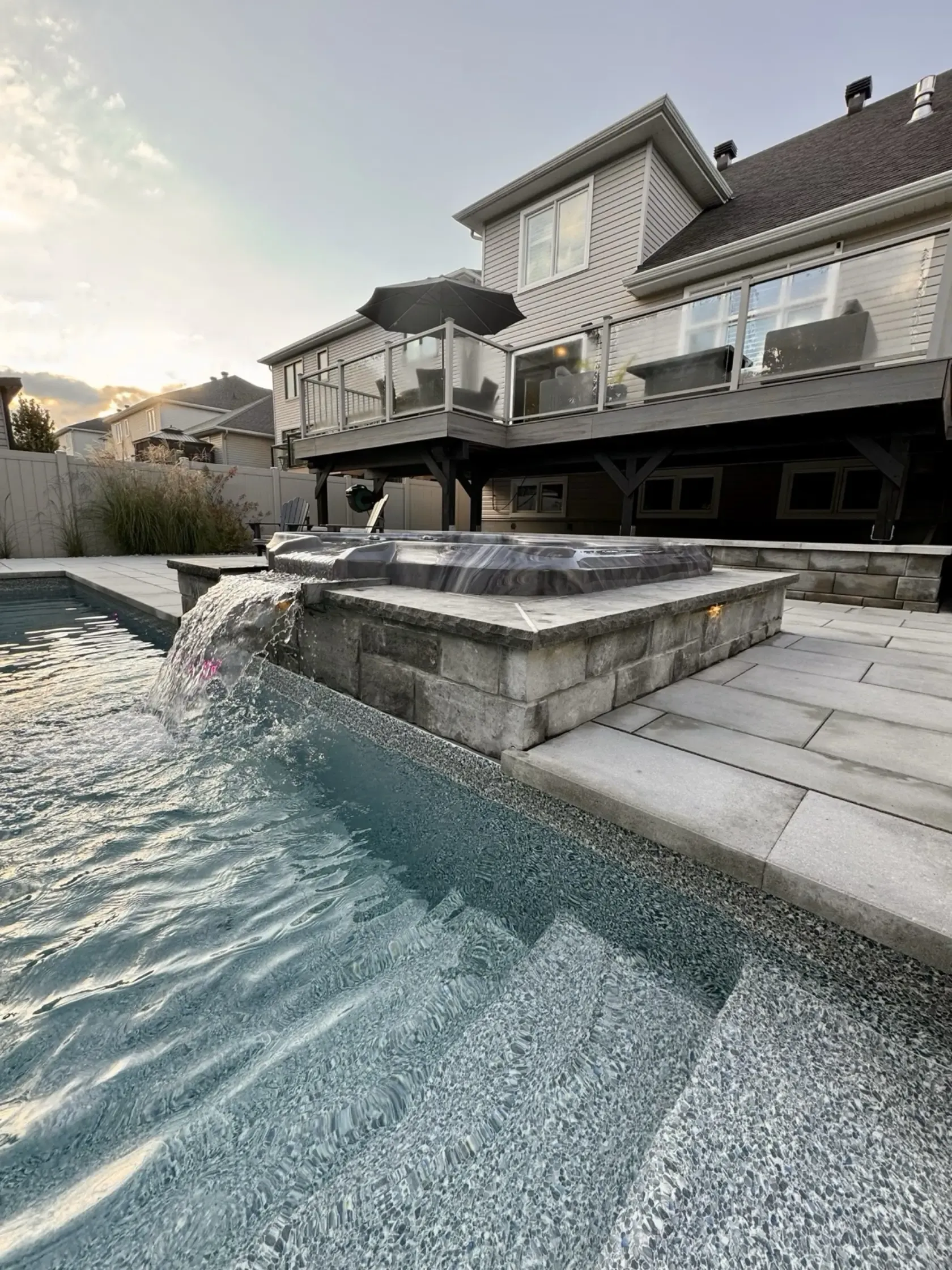 Integrated pool and spa