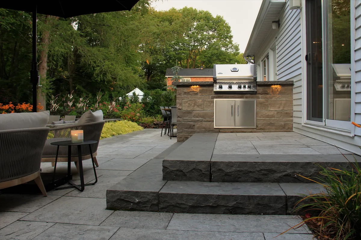 Chesswood outdoor kitchen and natural-stone terrace