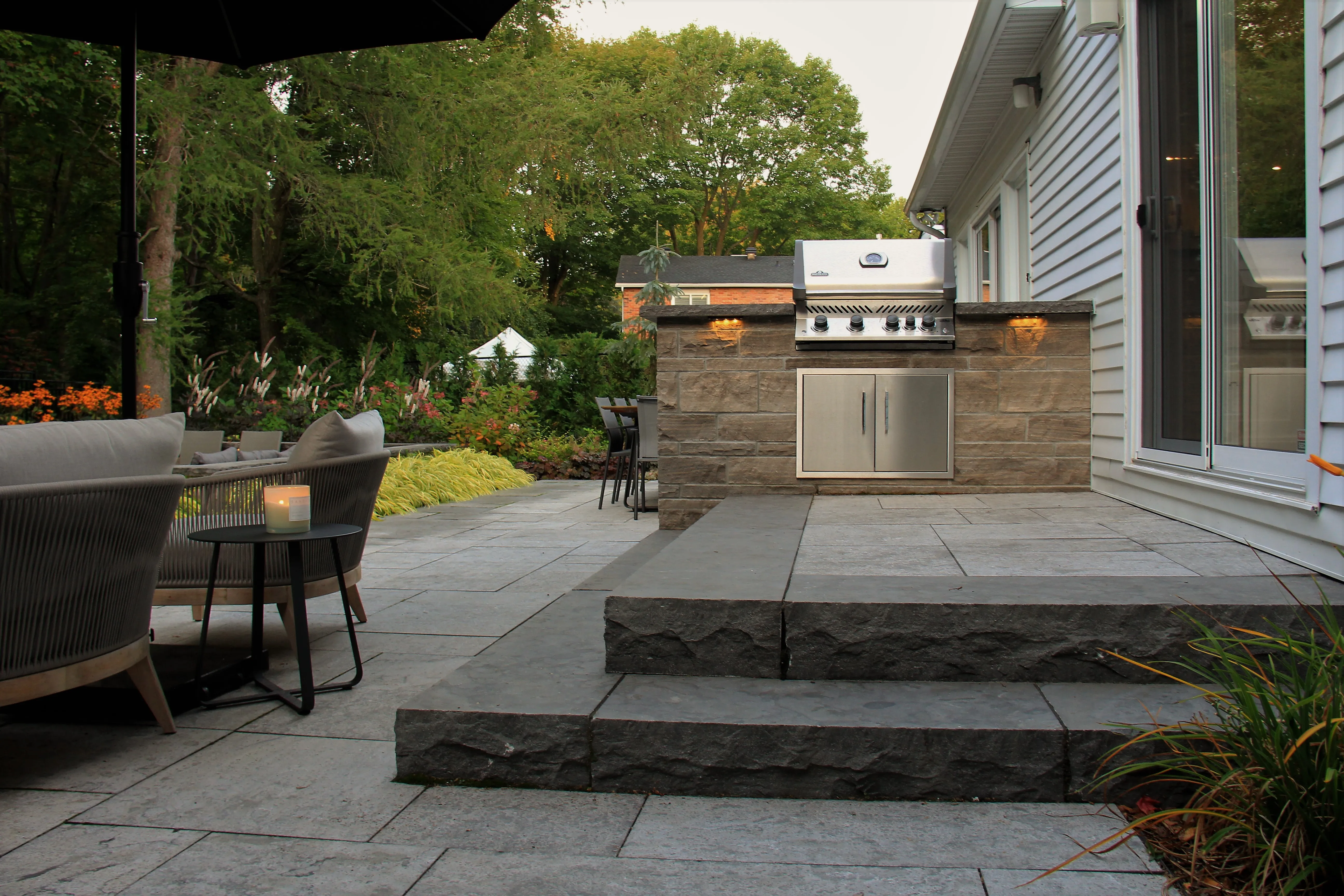 Chesswood outdoor kitchen and natural-stone terrace
