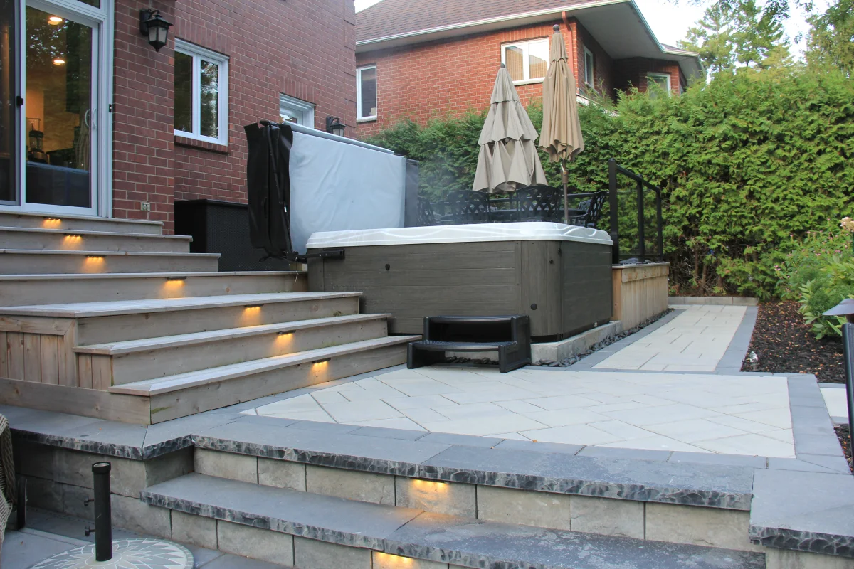 Rivercrest deck, spa, illuminated steps and pool terrace