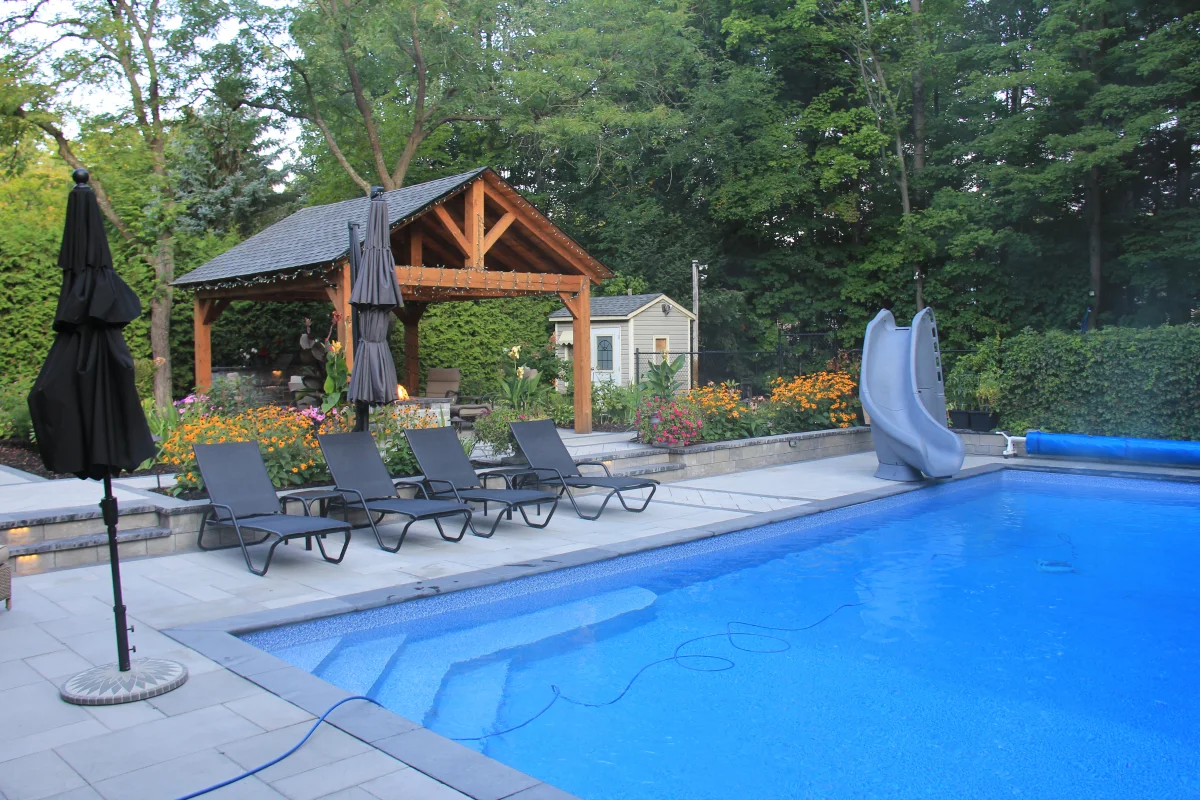 Rivercrest pool, slide, timber cabana and garden planting