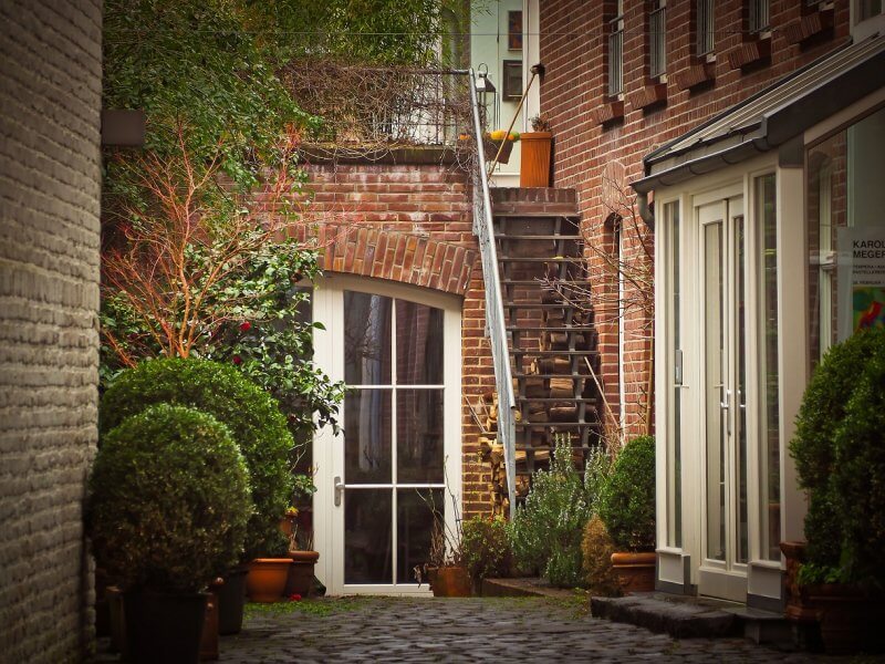 Shot of urban backyard with lots of greenery and interlocking stone