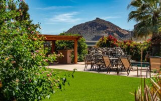 Tropical backyard with pool and mountain in the background