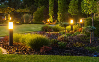 a landscaped area with lighting to brighten up the area